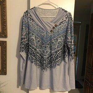 Long sleeved 2X Tee shirt with patterns, folds, and buttons in blues.